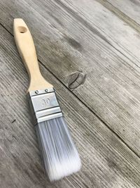 High angle view of paintbrush on wooden table