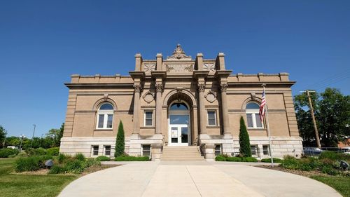 Facade of historic building against clear blue sky