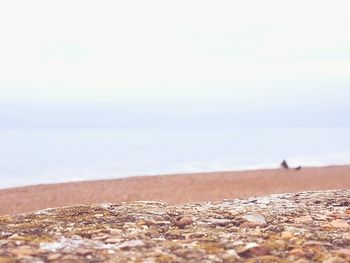 Surface level of beach against sky