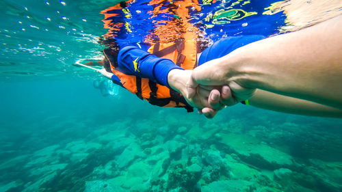 People scuba diving in sea