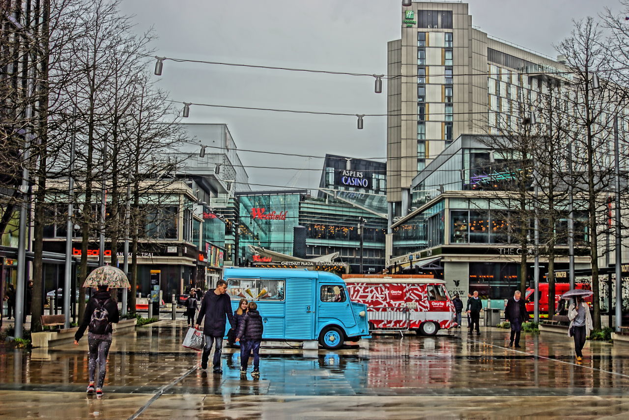 GROUP OF PEOPLE ON CITY STREET