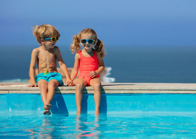 Full length of young woman in swimming pool