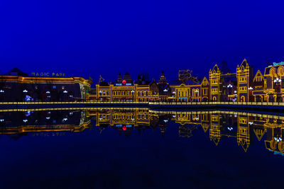 Illuminated buildings in water