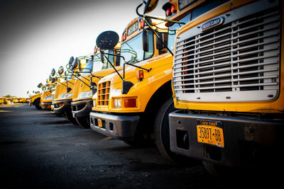 Yellow bus on road in city