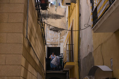 Rear view of people working in building