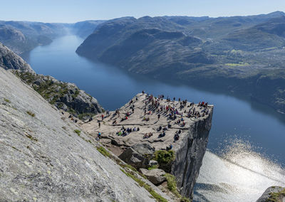 Preikestolen  a tourist attraction in norway. a steep cliff which rises 604 metres above lysefjorden