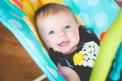 Portrait of baby girl relaxing in stroller