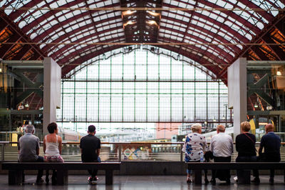 Rear view of people sitting in a building