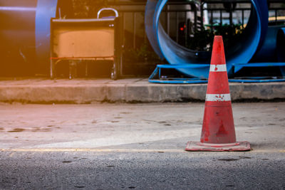 Traffic cone on road in city