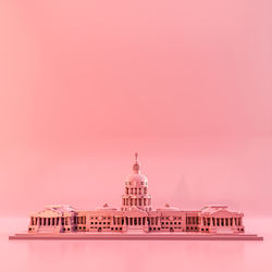 Capitol hill plastic toy isolated on pink 