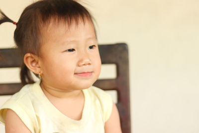 Portrait of cute boy looking away