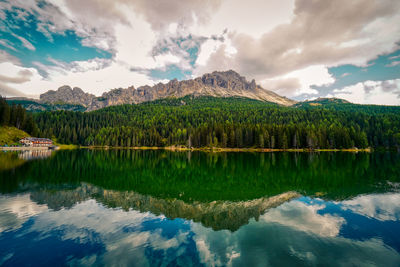 Scenic view of lake and mountains against sky