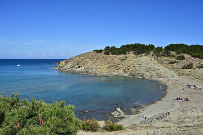 Scenic view of sea against clear blue sky