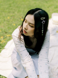 Portrait of young woman looking away