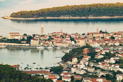 High angle view of townscape by sea