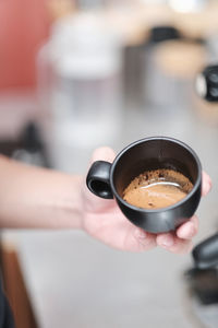 Woman holding coffee cup