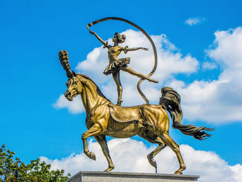 Low angle view of statue against sky