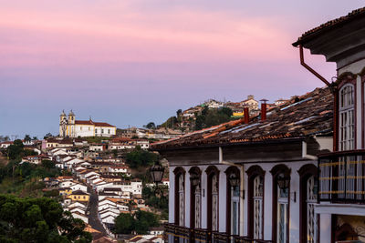 Arch bridge over buildings in city