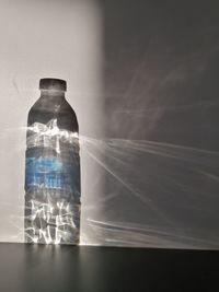 Close-up of glass bottle on table