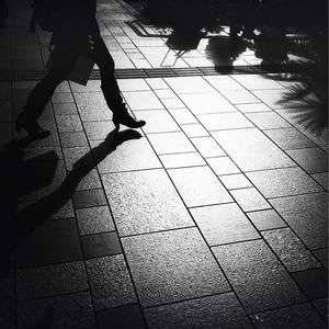 Low section of people walking on footpath