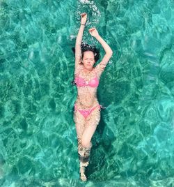 High angle view of woman swimming in pool