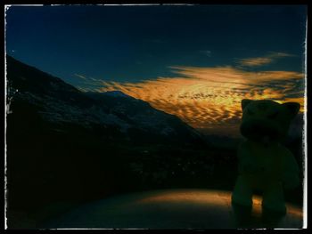 Close-up of dog against blue sky