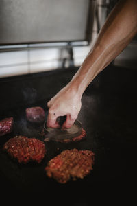 Chef frying burgers