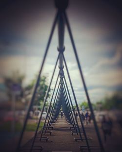 Close-up of footbridge against sky