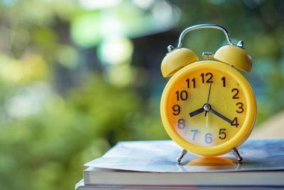 Close-up of clock on table