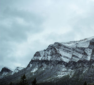 Low angle view of snowcapped mountain against sky