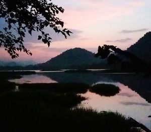 Scenic view of lake against sky during sunset