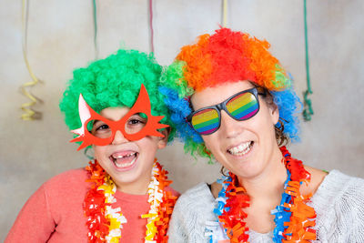 Mother and son celebrating carnival at home