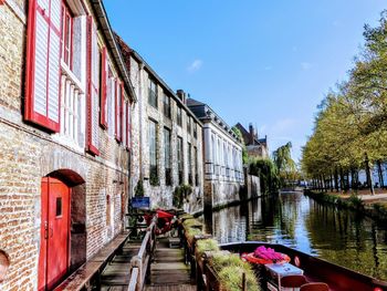 View of canal amidst buildings