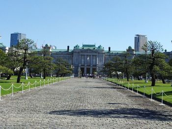 View of buildings in city against clear sky