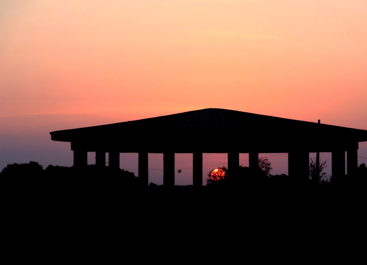 SILHOUETTE HOUSE AGAINST SKY DURING SUNSET