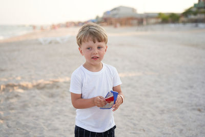 Boy standing on beach