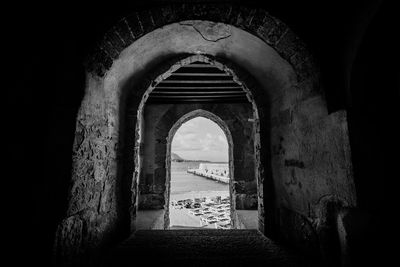 Archway of historic building against sky