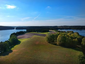 Scenic view of lake against blue sky