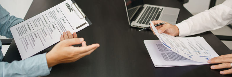 Midsection of business colleagues working in office