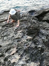Rear view of woman on sea shore