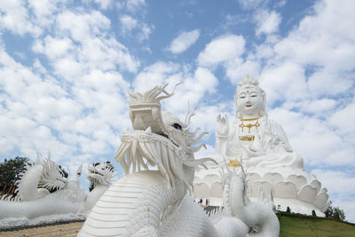 Low angle view of statue against sky