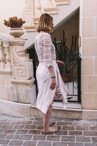 Rear view of woman on staircase