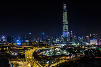 Illuminated buildings in city at night