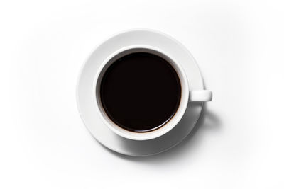Directly above shot of black coffee over white background