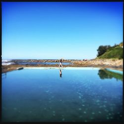 Scenic view of calm sea against clear sky