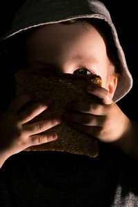 Close-up portrait of young woman with cat
