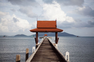 Pier over sea against sky