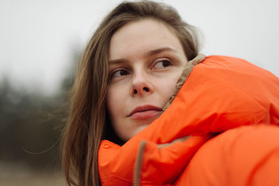 Portrait of young woman smiling outdoors