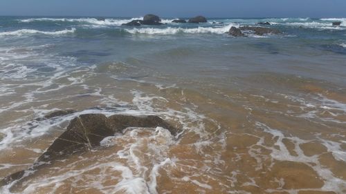 Waves breaking on beach