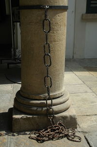 Close-up of chain against wall